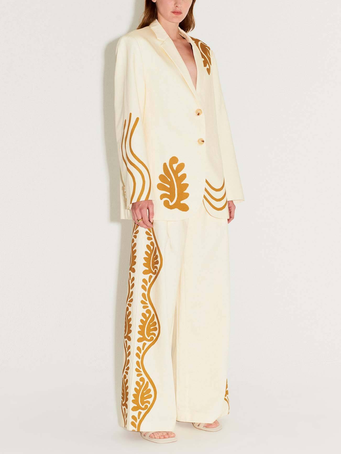 Wykwintne abstrakcyjne spodnie garniturowe z kieszeniami w kwiatowy wzór