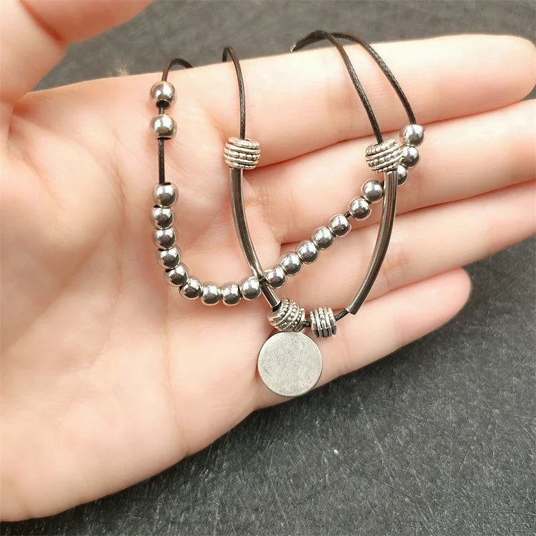 Cavigliera a strati con perline e ciondolo tondo in lega stile Boho