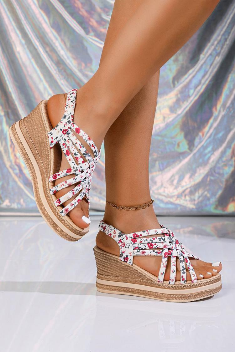 Sandalias de cuña con punta redonda, tiras tejidas y estampado floral