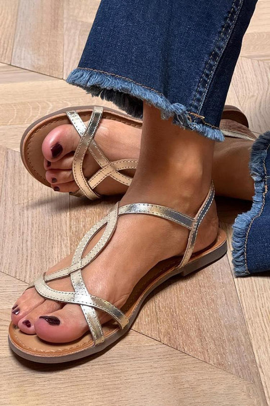 Sandalias doradas con punta redonda y tiras asimétricas con brillo metálico [Reserva]