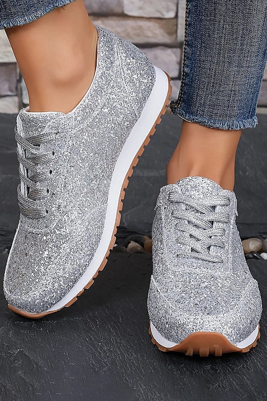 Sneakers in tinta unita con punta tonda e pizzo con paillettes glitterate