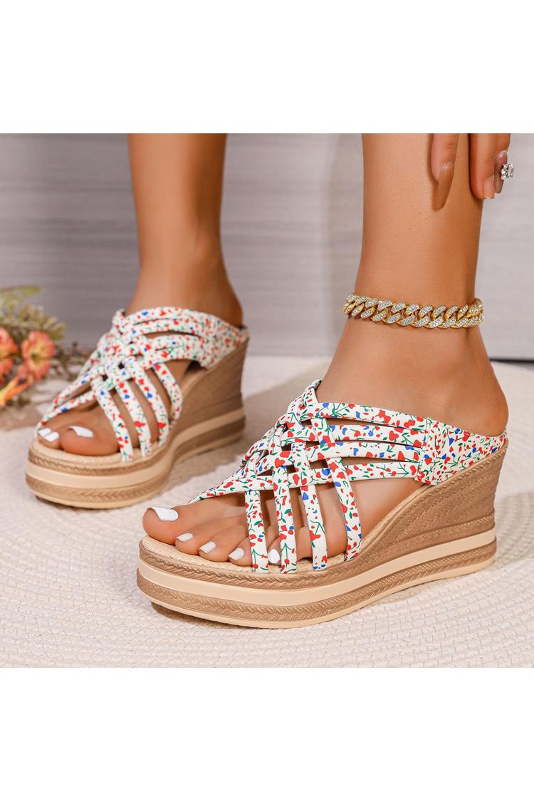 Sandalias de cuña con punta redonda, tiras tejidas y estampado floral