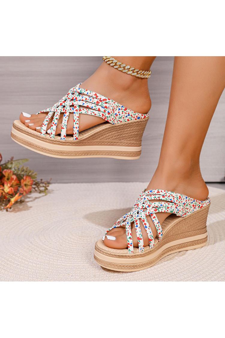 Sandalias de cuña con punta redonda, tiras tejidas y estampado floral