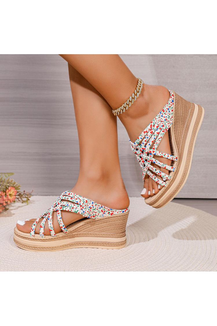 Sandalias de cuña con punta redonda, tiras tejidas y estampado floral