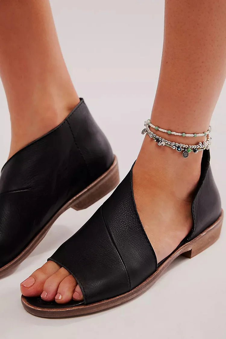 Sandali neri con punta tonda e tinta unita e ritaglio asimmetrico [Pre-ordine]