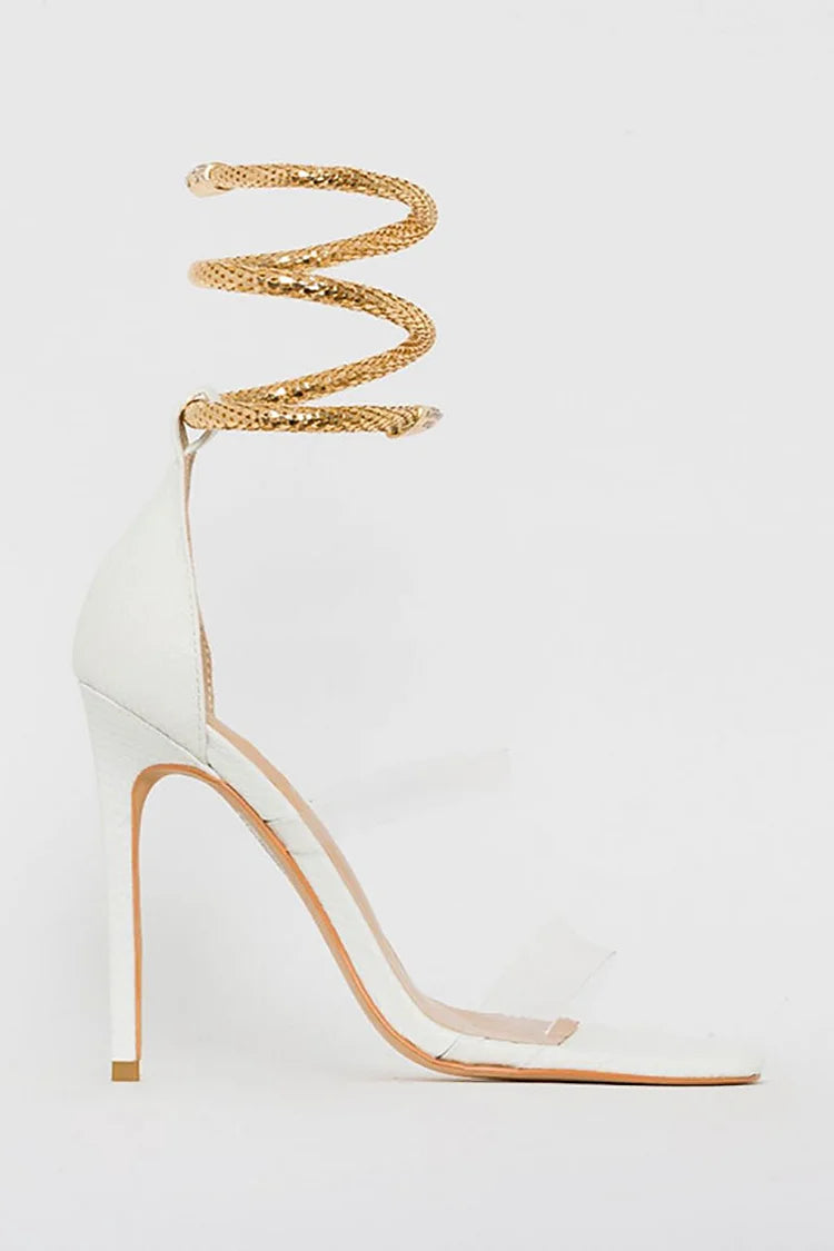 Sandalias de tacón de aguja con tiras transparentes en el tobillo y diseño de serpiente en dorado claro 
