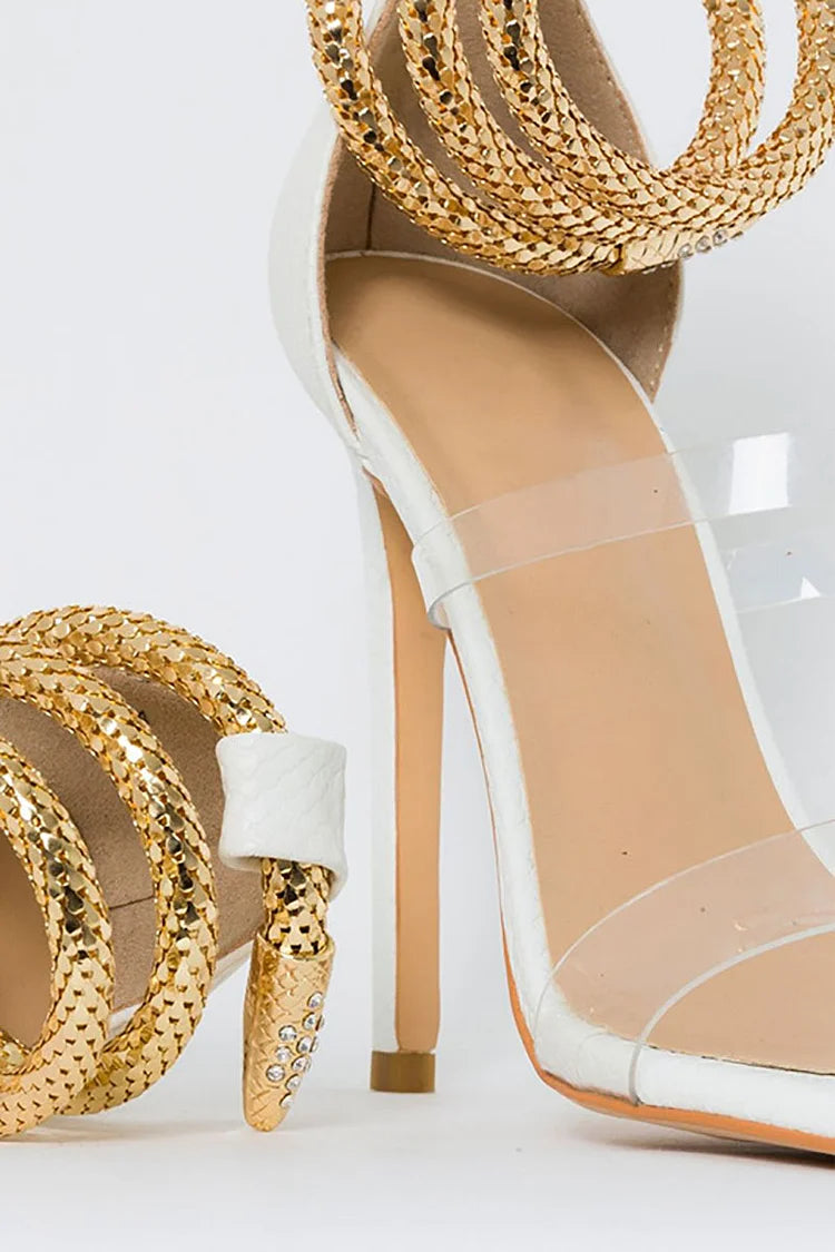 Sandalias de tacón de aguja con tiras transparentes en el tobillo y diseño de serpiente en dorado claro 