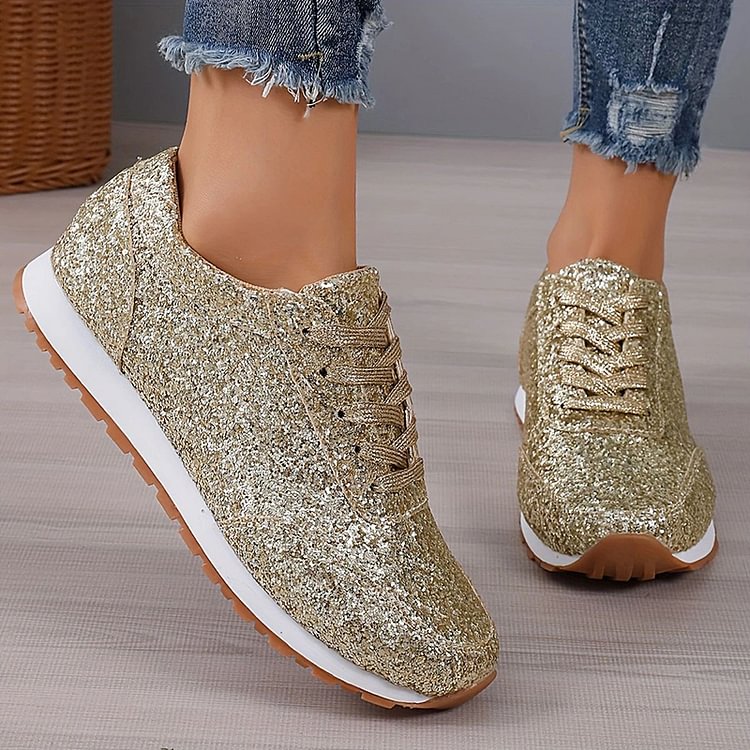 Sneakers in tinta unita con punta tonda e pizzo con paillettes glitterate